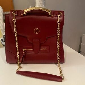 Never used red shoulder bag. Good condition